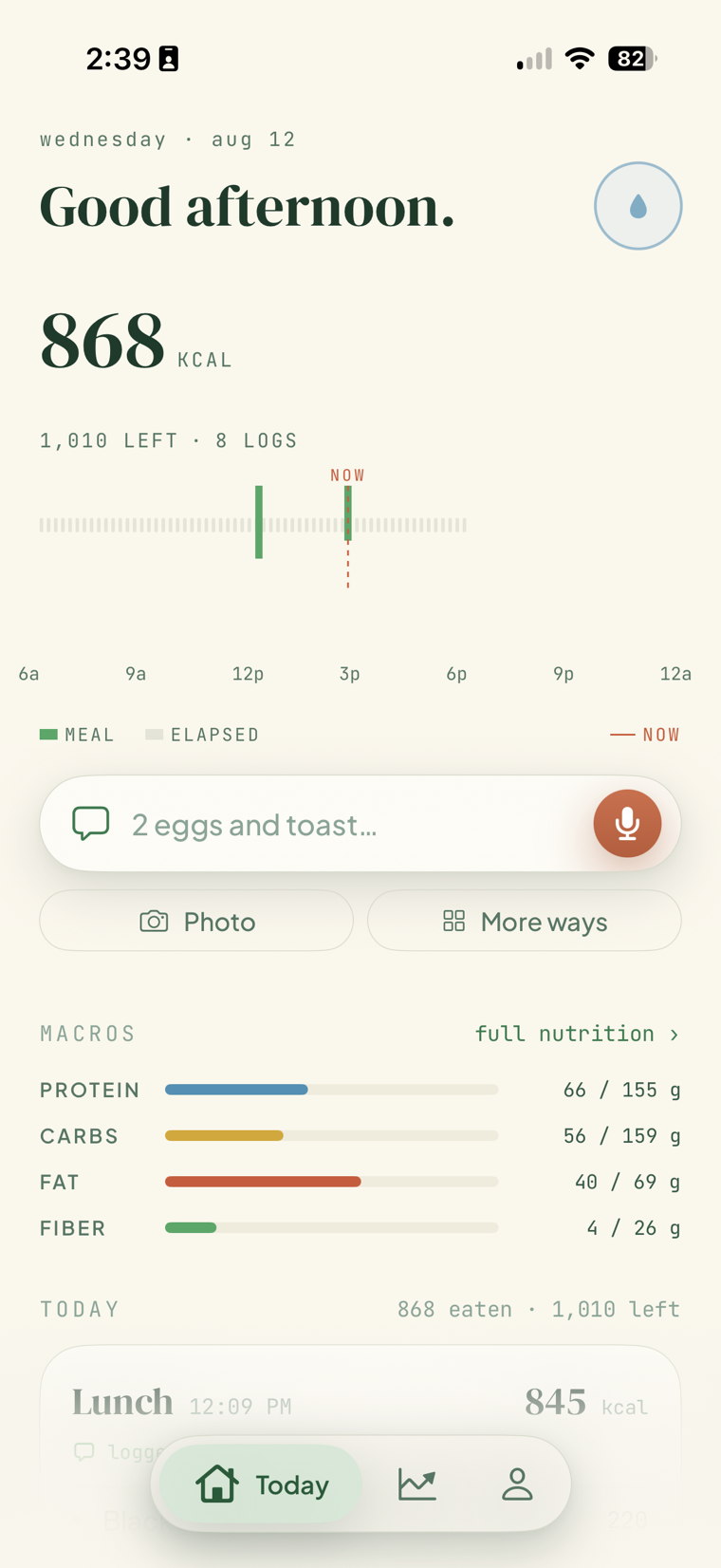 FitGlass Today screen showing calories, the day timeline, the chat and mic log bar, and macro bars